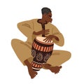 A young street musician plays a rhythmic melody on a conga drum decorated with an African pattern.